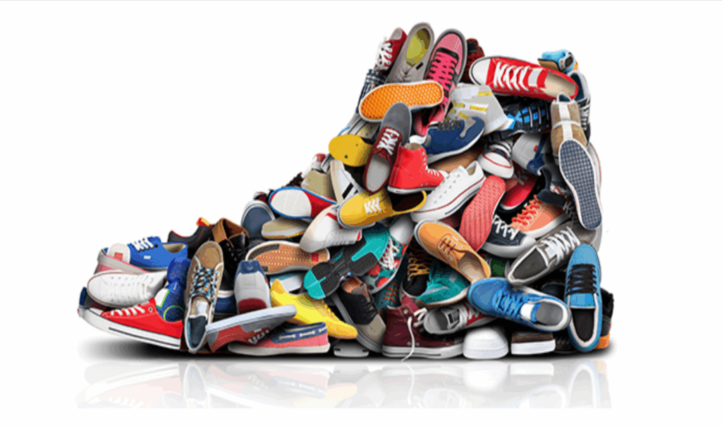 Pile of assorted athletic shoes and sneakers.