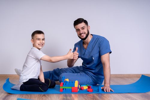 Pediatric physical therapy care and rehabilitation exercises.