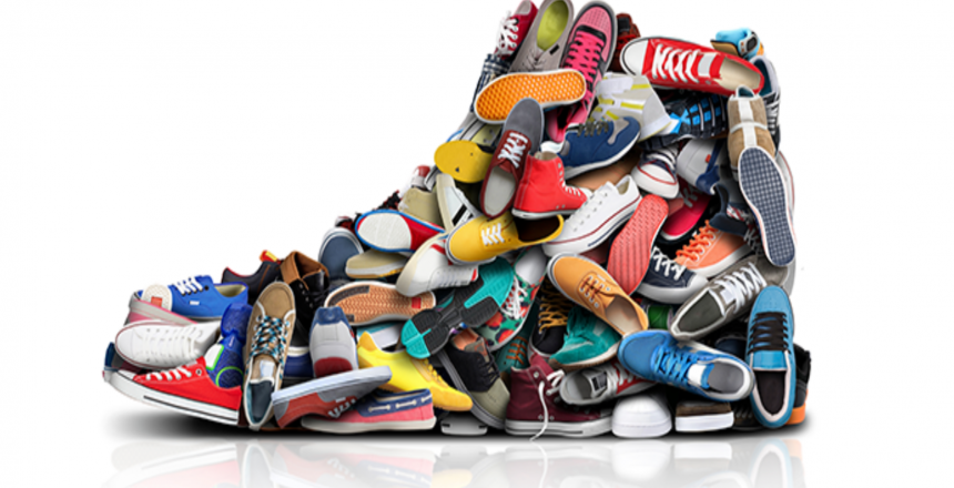 Pile of assorted athletic shoes and sneakers.