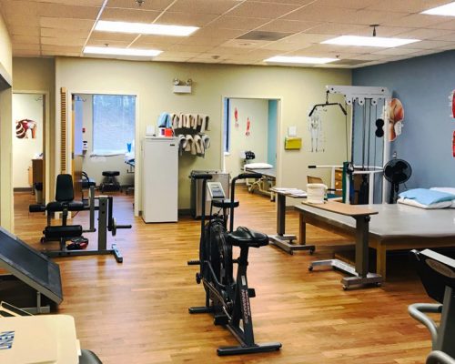 Interior of a Dosher Physical Therapy clinic treatment area.