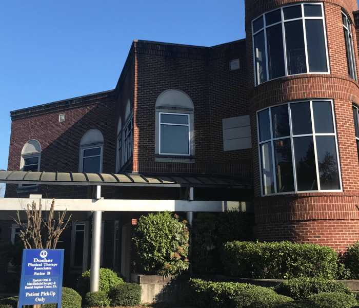Exterior of Dosher Physical Therapy Associates building with clinic sign.