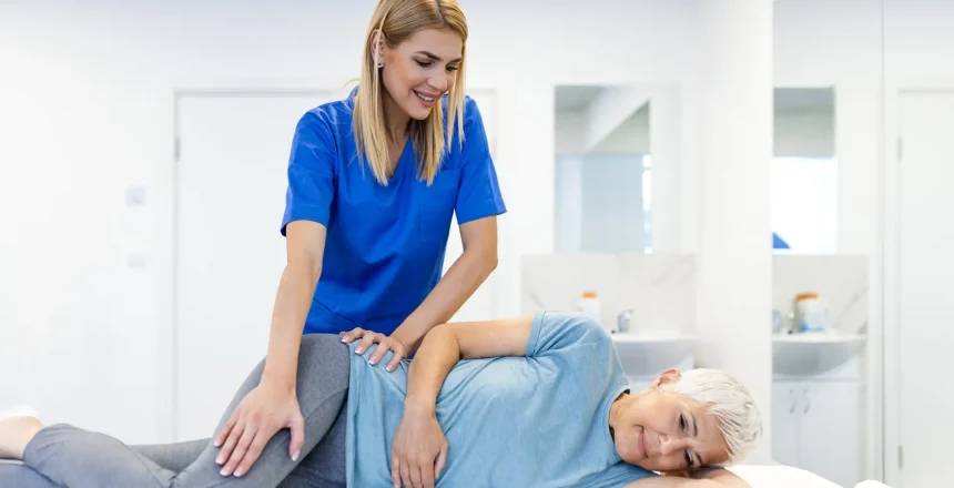 Professional,Female,Therapist,Performing,Manual,Hip,Therapy,On,A,Senior