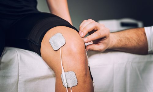 Tens,Electrodes,Positioned,For,Knee,Pain,Treatment,In,Physical,Therapy